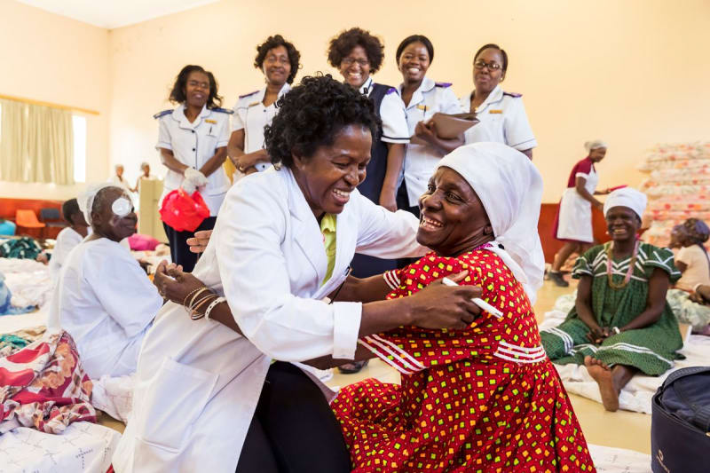 Dr. Helena Ndume embraces a patient after the bandages come off - Oshakati, Namibia